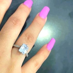 Adjustable emerald cut ring